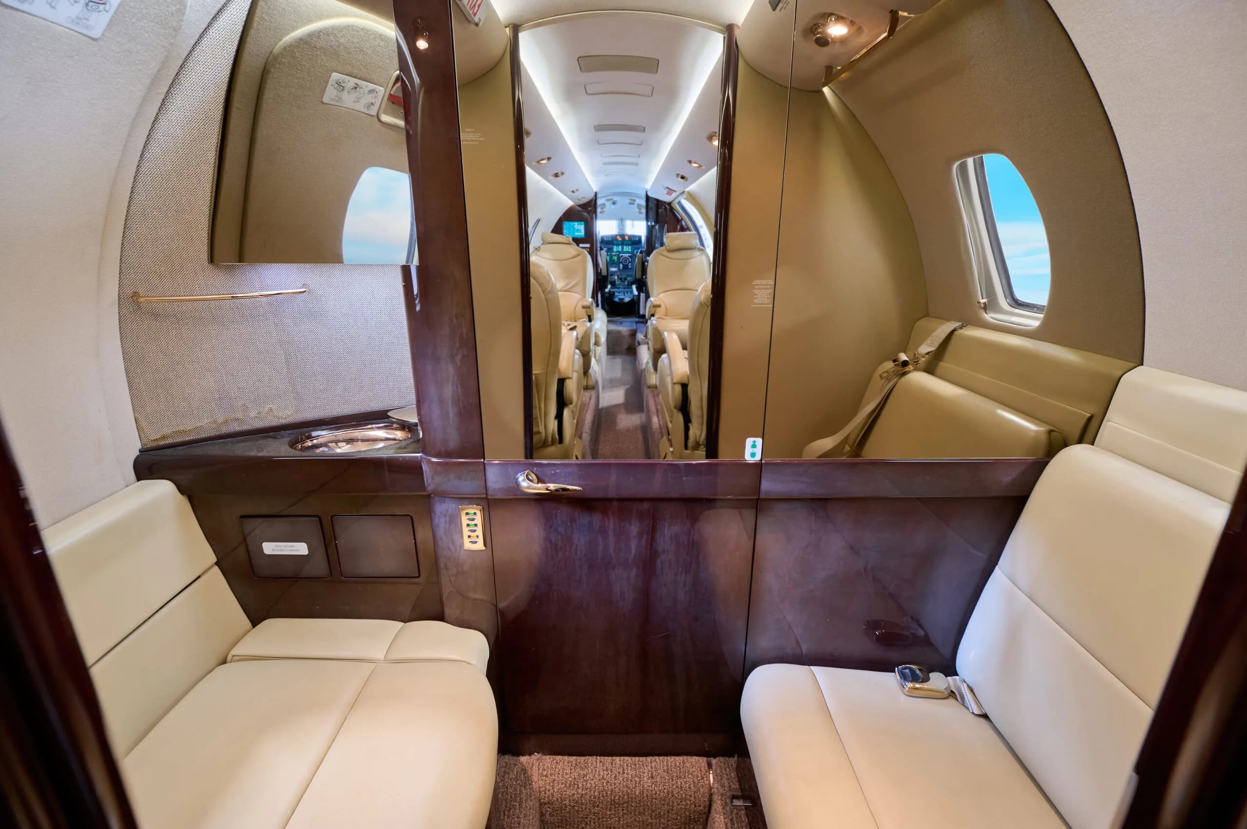 View of the Cessna Citation CJ3 cabin looking towards the cockpit from the rear.