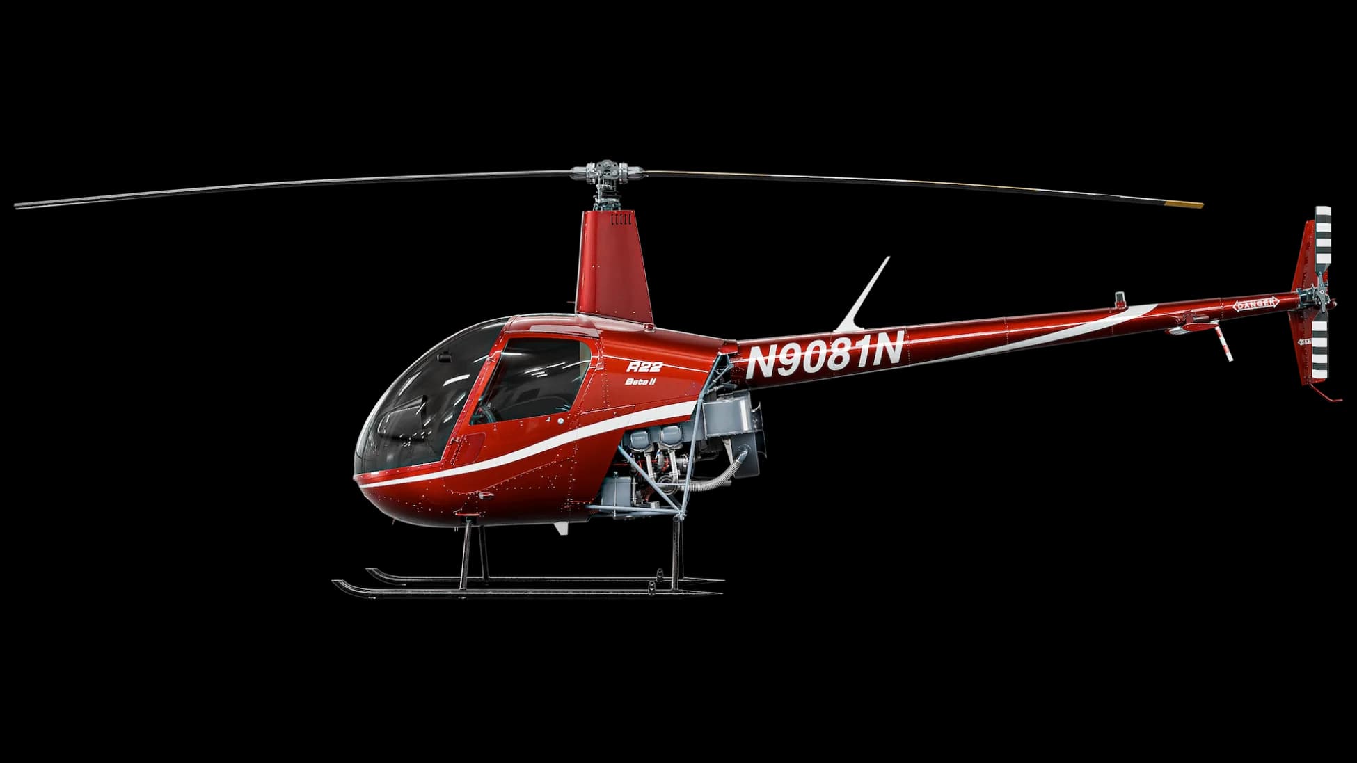 A red and white Robinson R22 Beta II helicopter on a black background.