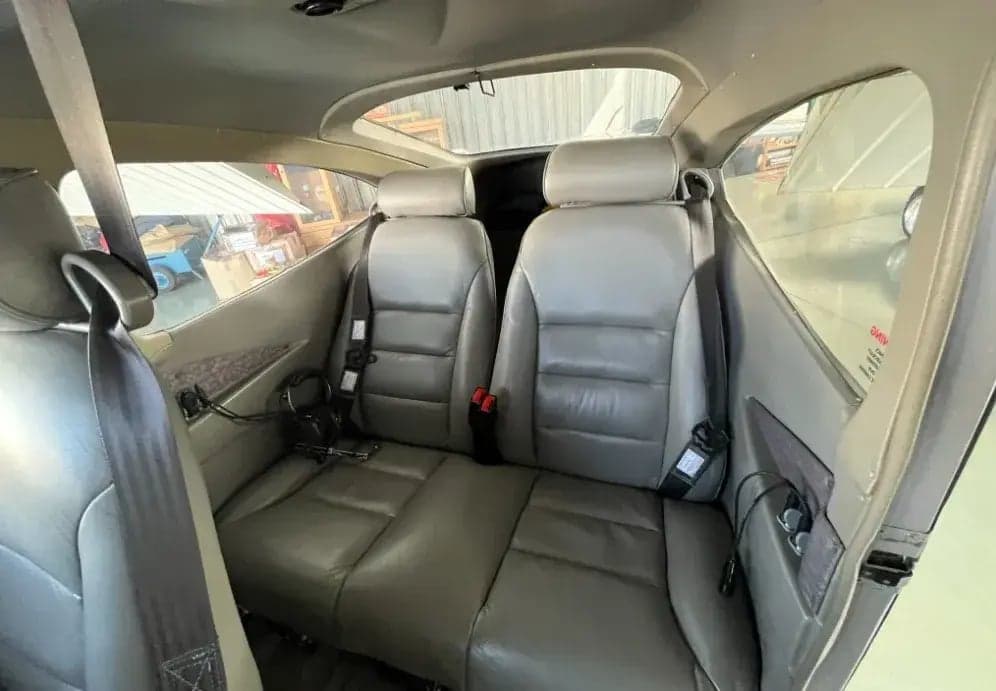 Interior view of the aircraft cabin, showing the seating arrangement and upholstery.