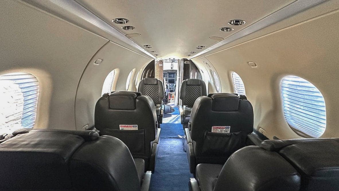 Interior view of the Pilatus PC-12 cabin with leather seats.