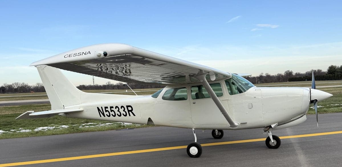 A Cessna 172 aircraft with tail number N5533R parked on the tarmac.