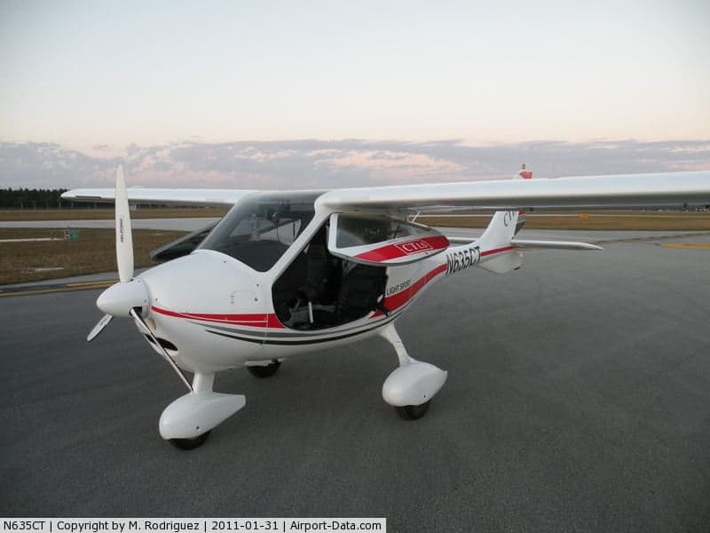 A white and red CTLS Light Sport aircraft, registration N635CT, is parked on the tarmac.