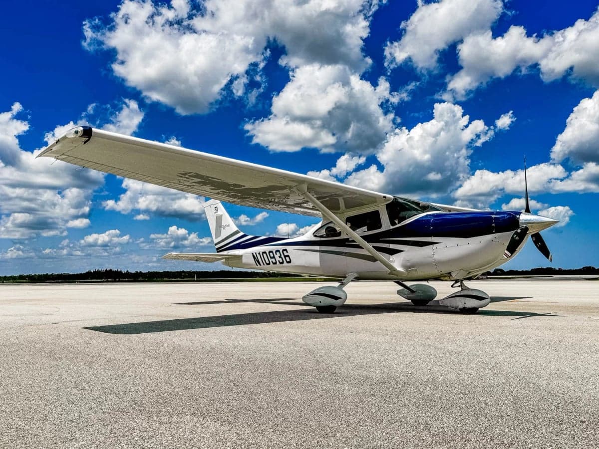 Cessna 182 Skylane, N10936, parked on the tarmac with a blue and white paint scheme.