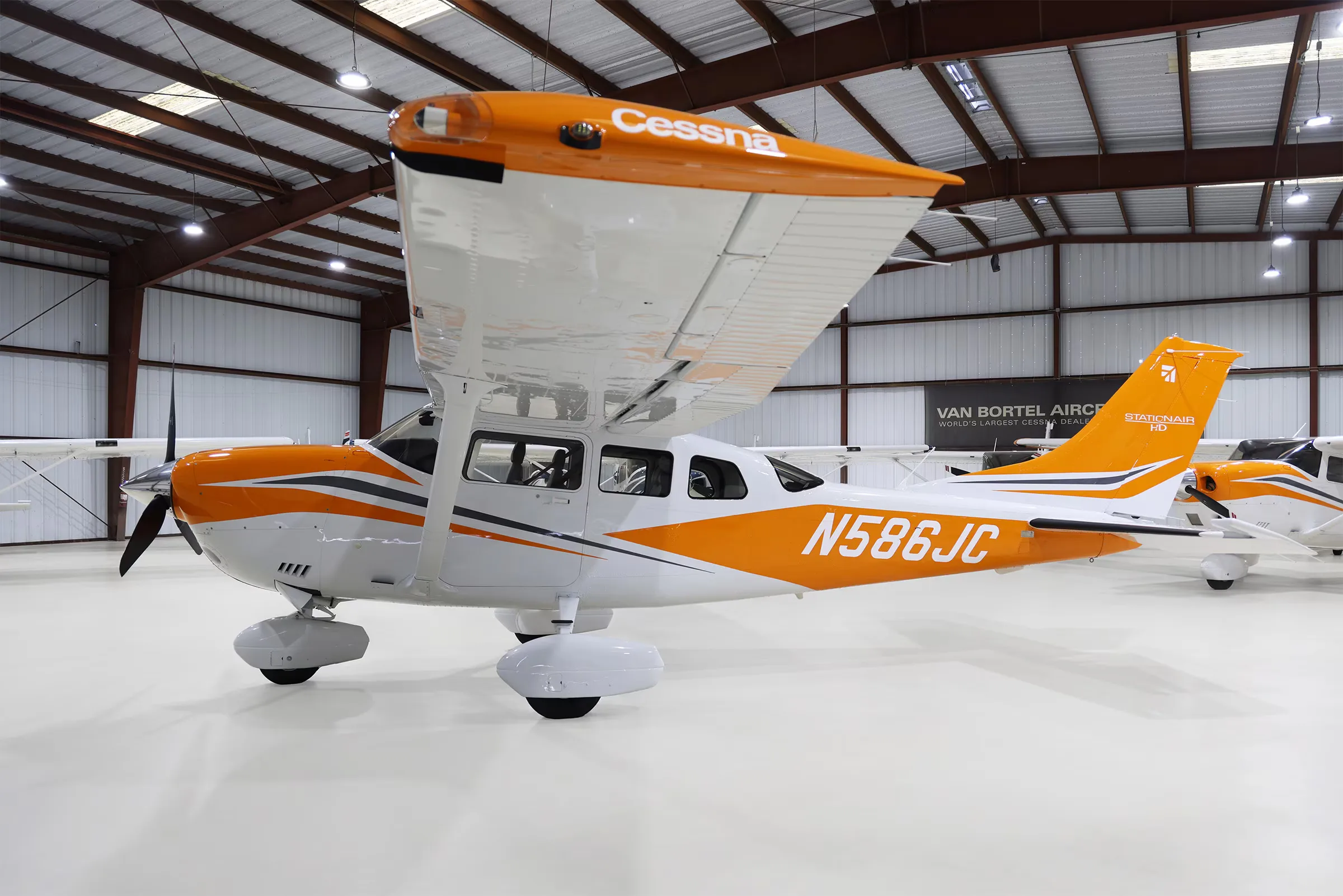 N586JC Cessna Stationair T206H in a hangar, side view.