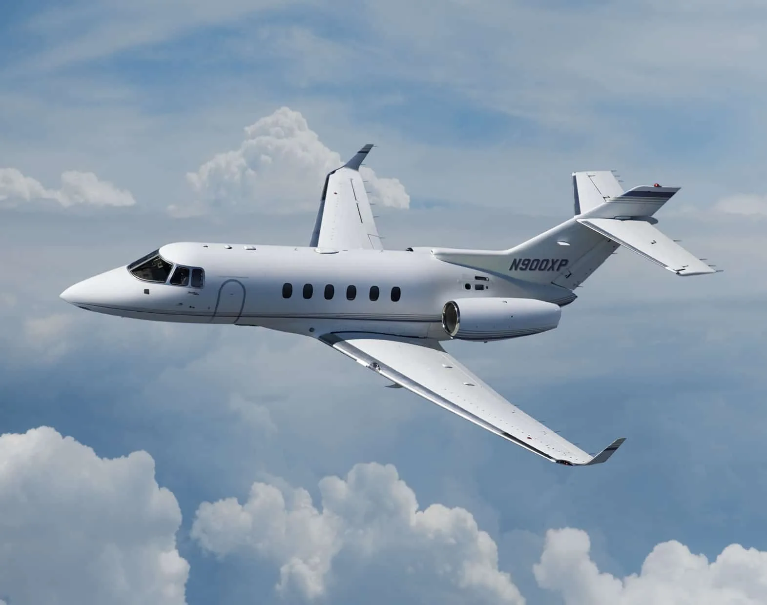 A Hawker 900XP aircraft in flight with registration N900XP.