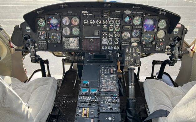 Bell 222 helicopter on the tarmac.