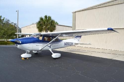 Cessna 172 Skyhawk aircraft N6822M parked on the tarmac with a blue and white paint scheme.