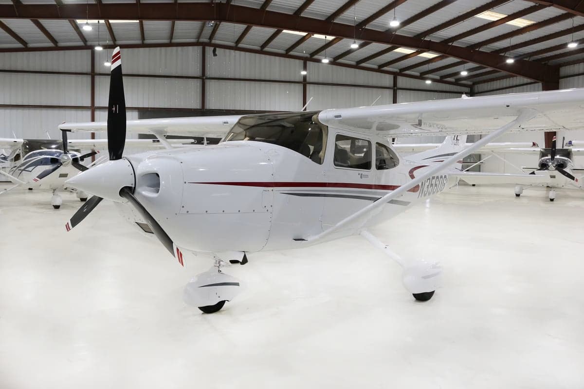 A Cessna aircraft with tail number N3560G is parked in a hangar.