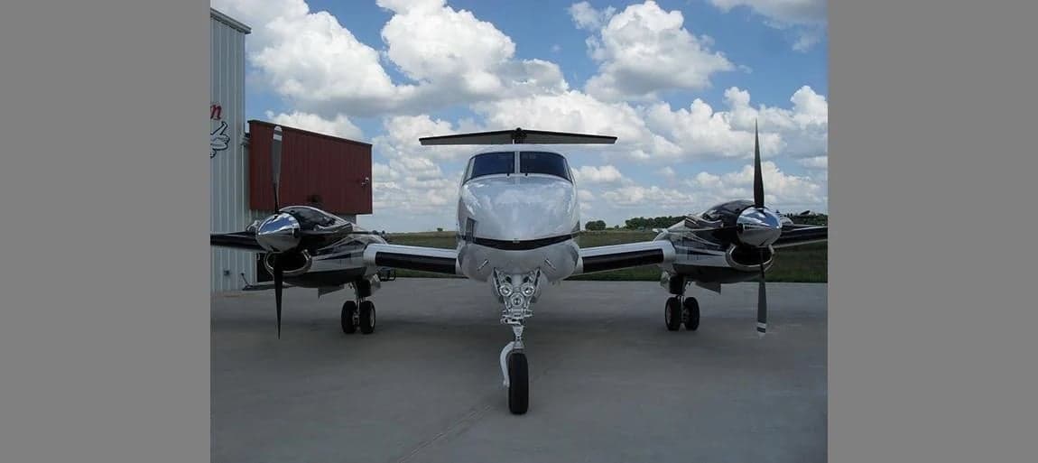 Front view of a King Air aircraft on the ground.
