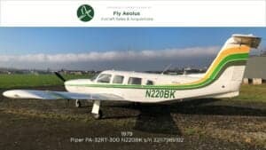 Piper PA-32RT-300 Lance II aircraft with white and green paint scheme on the ground.