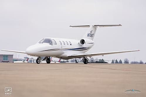 A Cessna Citation CJ1+ aircraft with tail number N72AC parked on the tarmac.