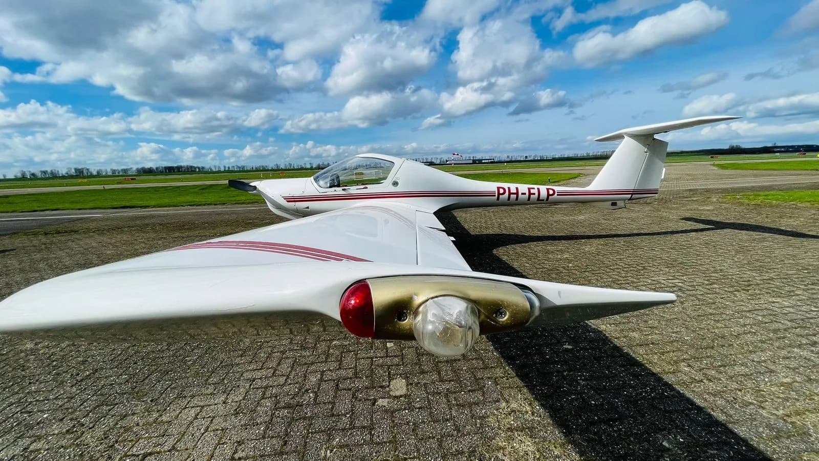 Diamond DV20 Katana aircraft with registration PH-FLP on the ground.