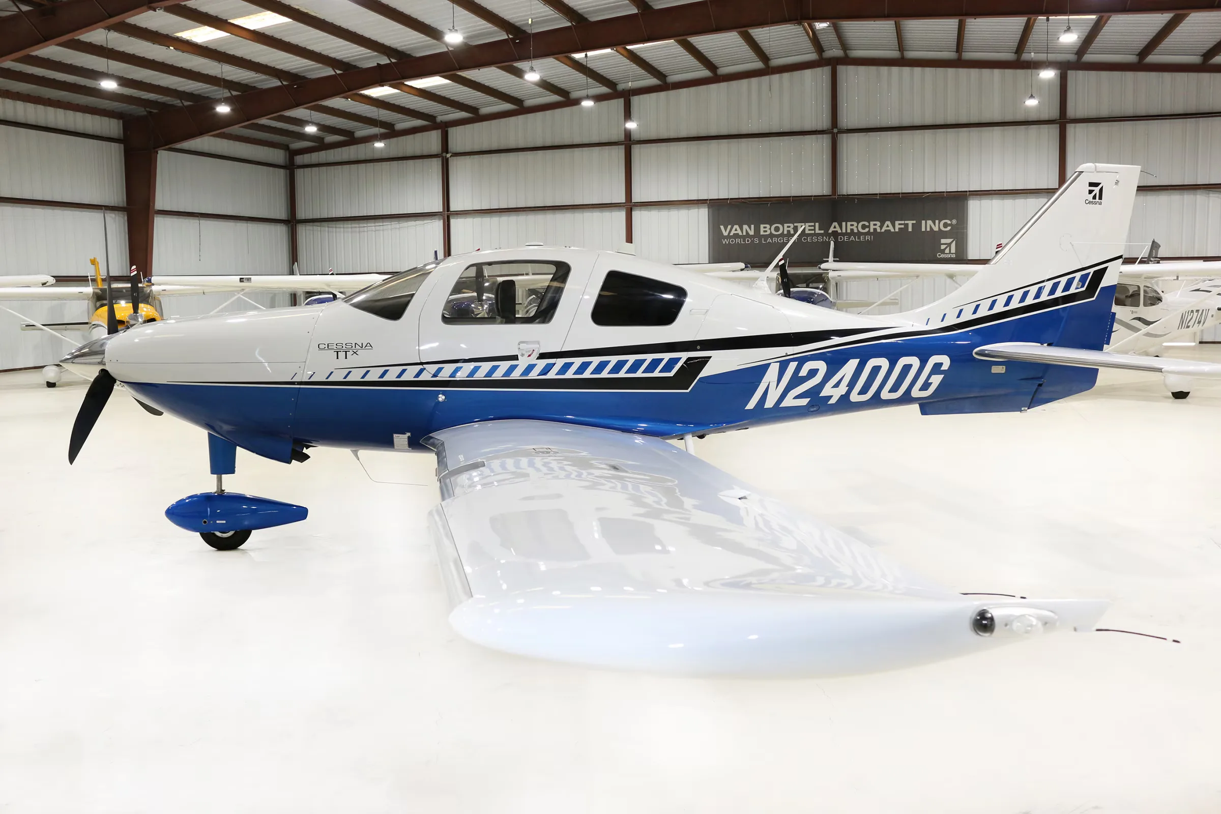 Cessna TTX aircraft N2400G in a hangar, side view.