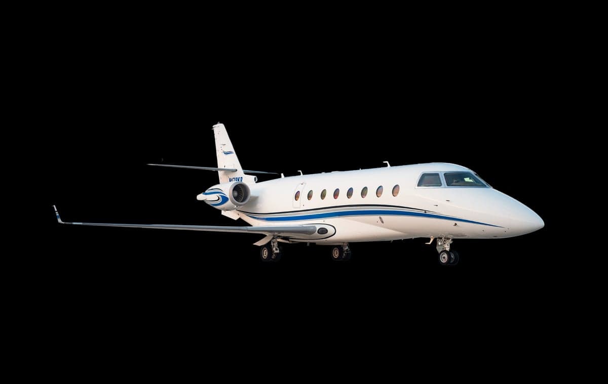 Gulfstream G280 aircraft with registration N178KR on a black background.