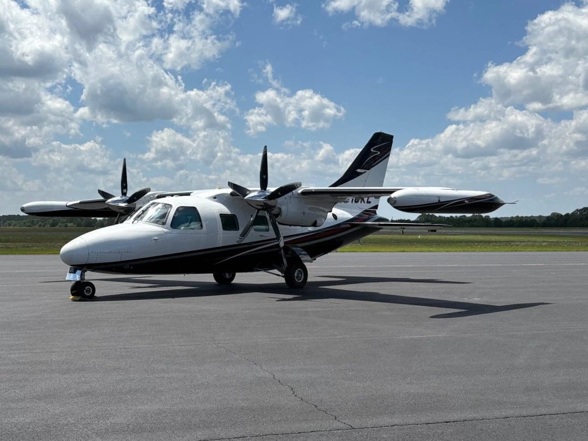 A three-quarter view of the Partenavia P.68 Observer 2 aircraft N616KL on the tarmac.