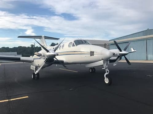 Front view of a King Air on the tarmac.