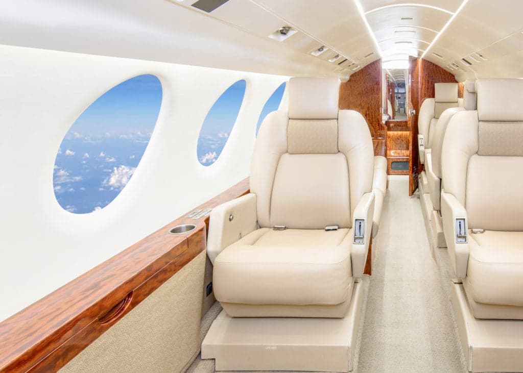 Close up of the engine and fuselage of a private jet.