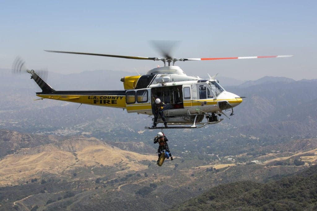 L.A. County Fire Bell 412 helicopter performing a rescue operation.
