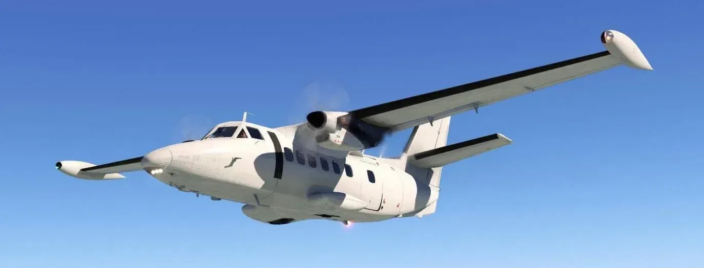 A white aircraft is flying in the sky.