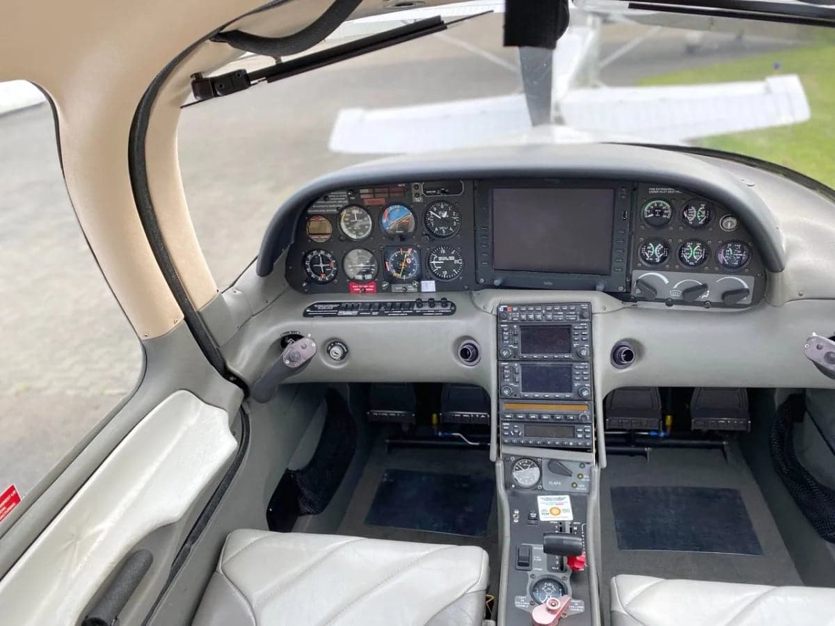 Cirrus aircraft D-ESFB parked on the tarmac.