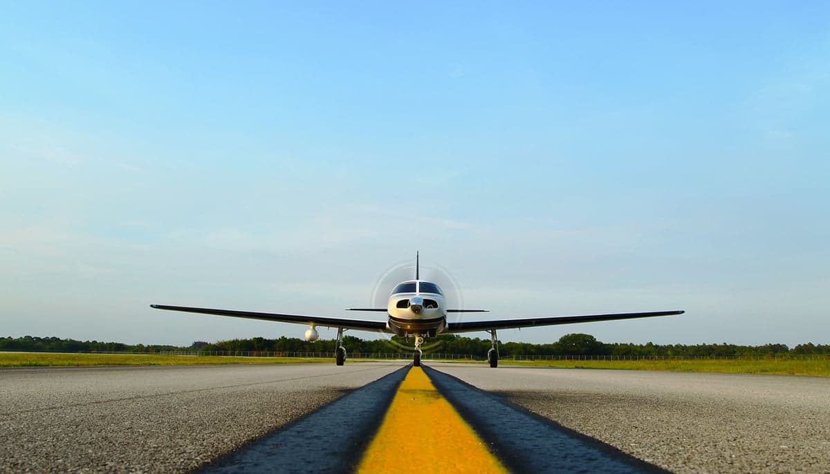 Front view of a Piper M350 on a runway.