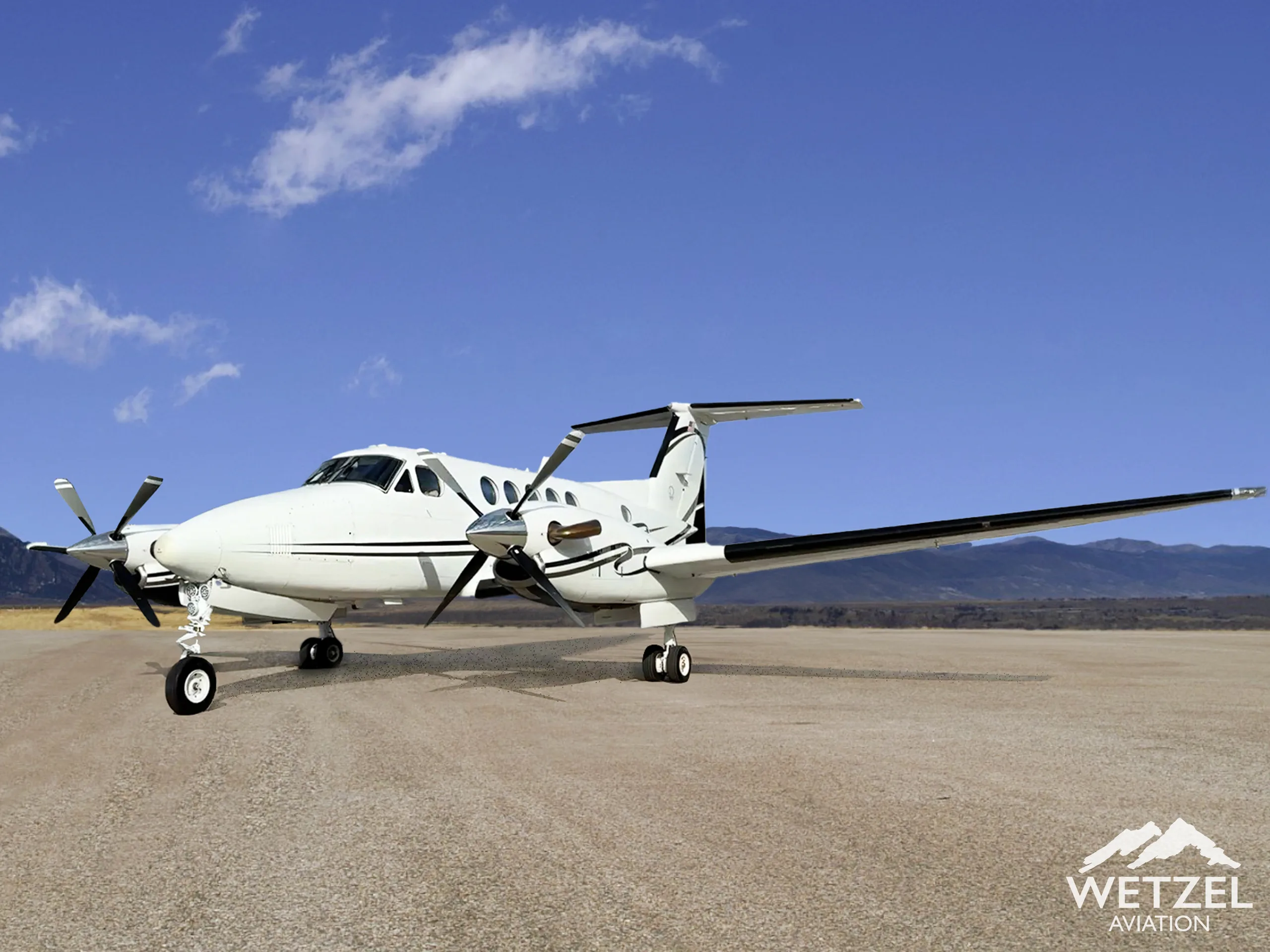 King Air 350 on the ground with a white and black paint scheme.