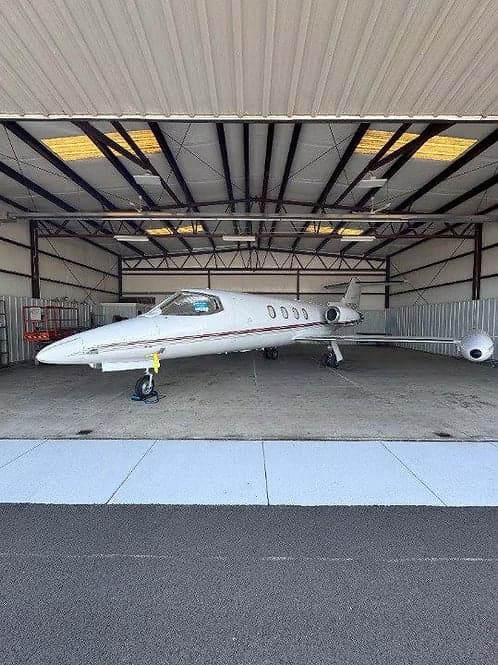 A Learjet 35A in a hangar.