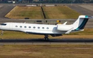 A Gulfstream business jet on the runway.