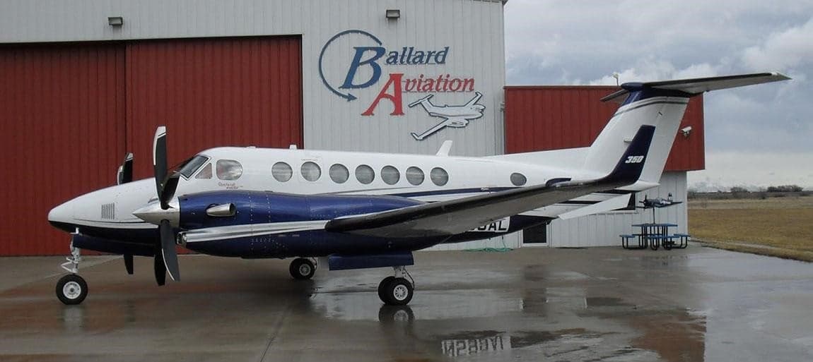 Beechcraft King Air 360 parked in front of a hangar.