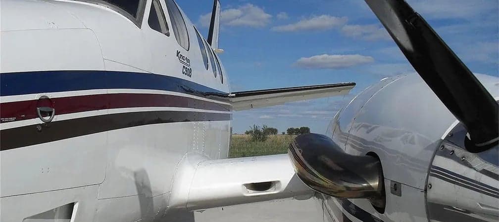 Close up of a King Air C90B's wing and propeller.