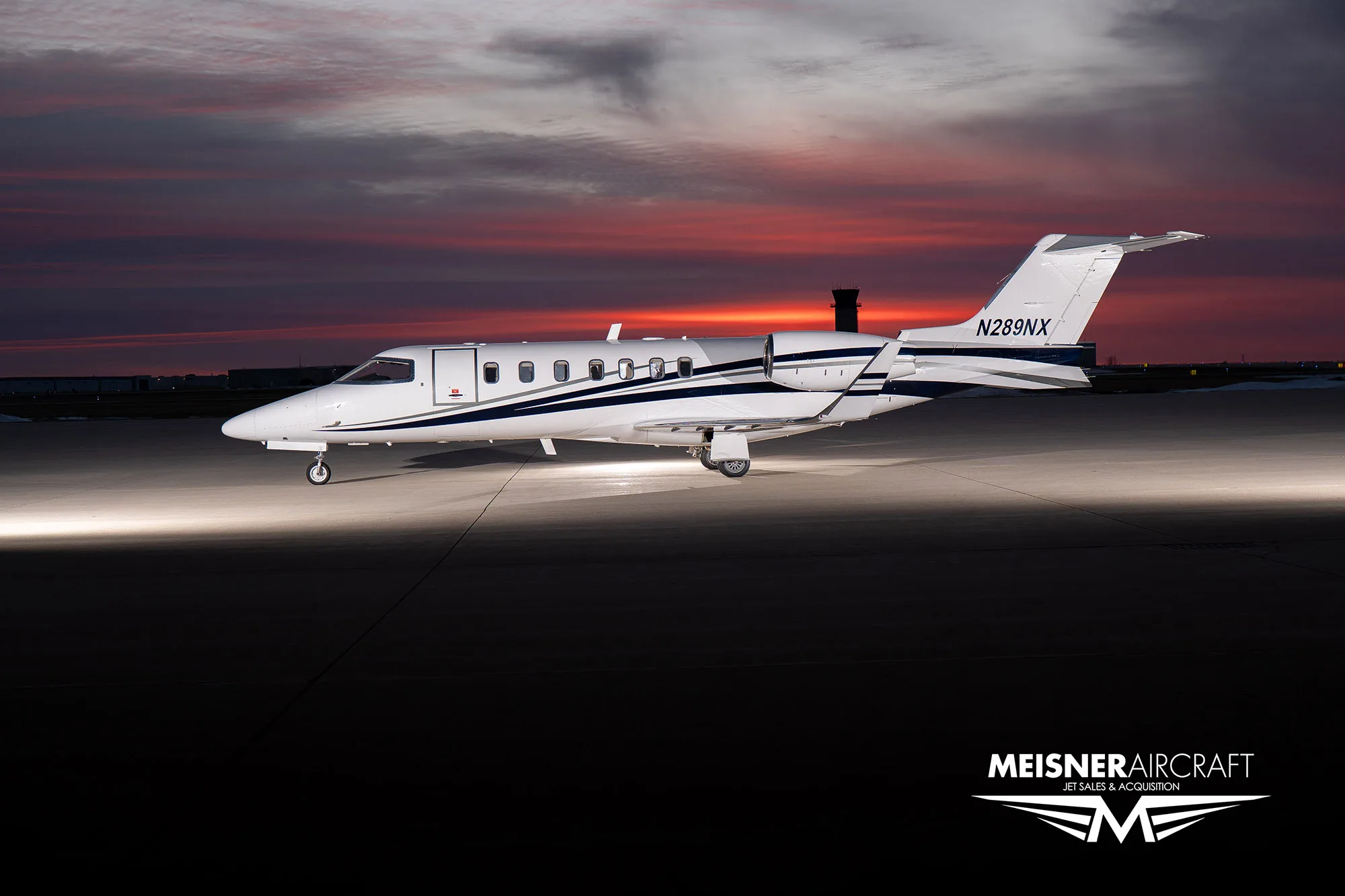 Learjet 45XR N289NX on the tarmac at dusk.