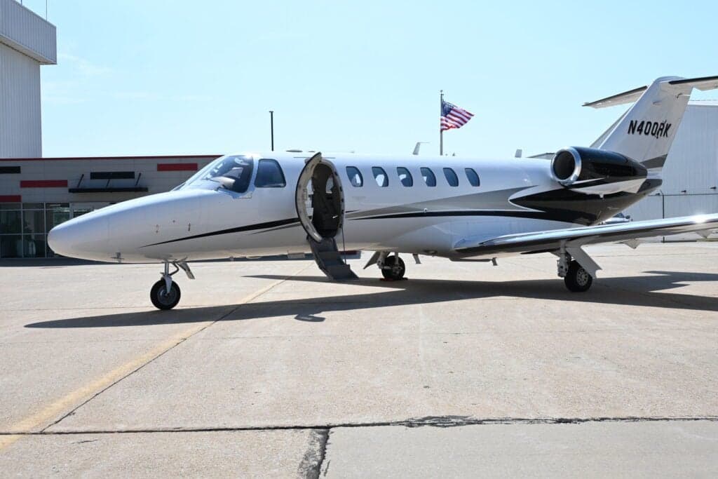 N400RK Cessna Citation CJ3+ on the ramp with the door open.