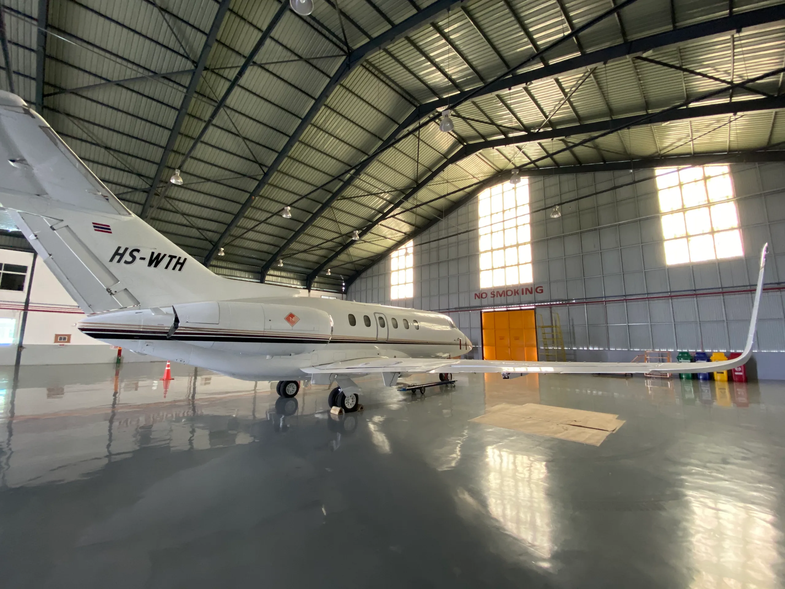 HS-WTH aircraft in a hangar, showing the tail and side profile.