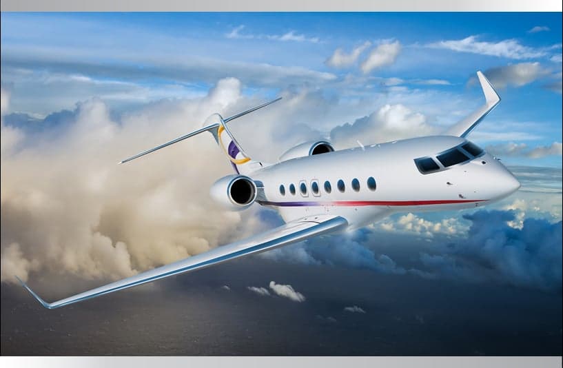 Generic aircraft flying in the sky with clouds.