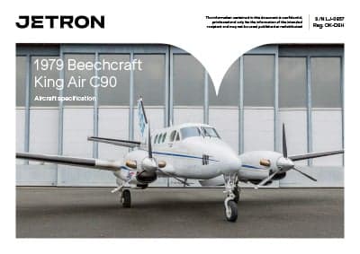 Front view of a 1979 Beechcraft King Air C90 aircraft in front of a hangar, as part of a Jetron specification document.