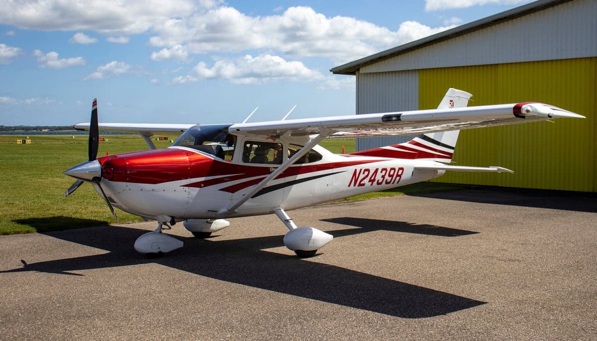 A Cessna Skylane TC, registration N2439R, parked on the tarmac with a red and white paint scheme.
