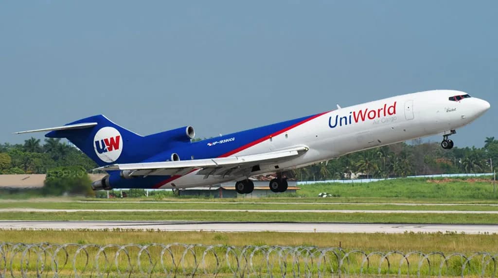 A UniWorld Air Cargo Boeing 727-200F, registration HP-1939UCG, takes off from a runway.
